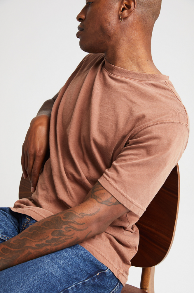 
                      
                        A man wearing the Relaxed Short Sleeve Men's Tee by Richer Poorer in the color Latte
                      
                    