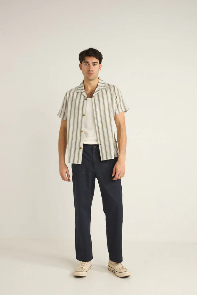 
                      
                        The Vacation Stripe Short Sleeve Short by Rhythm is available at Harbour Thread. 
                      
                    