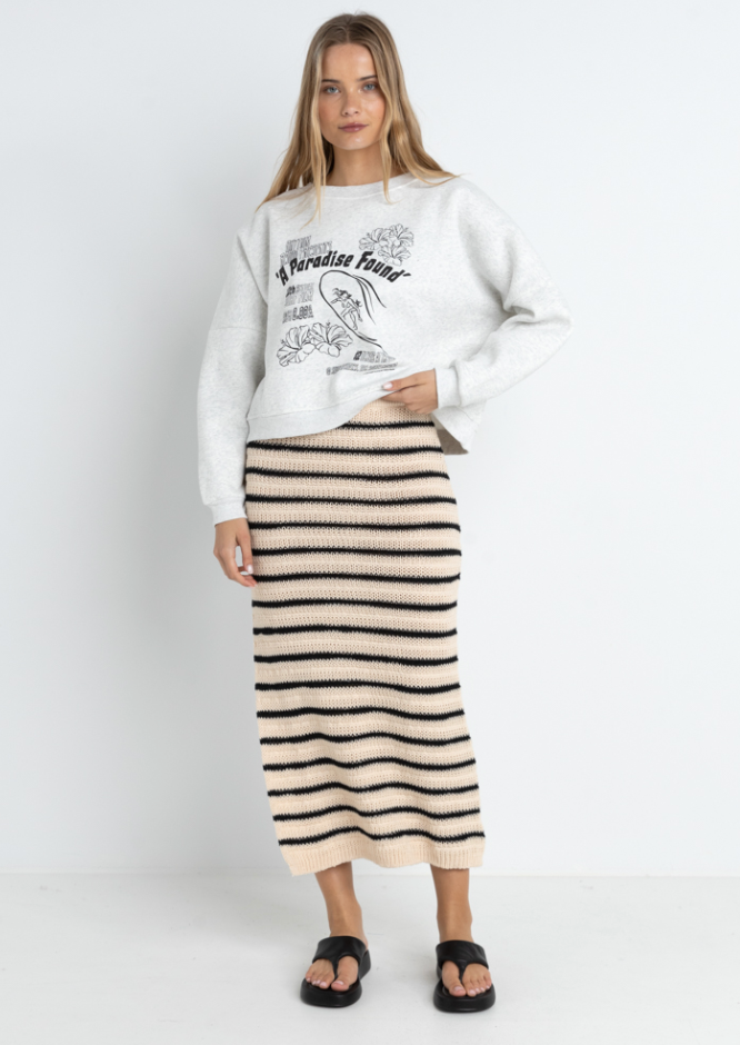Super soft and with a slim fit, the Highline Stripe Knit Midi Skirt by Rhythm is available at Harbour Thread for versatile and chic warm-weather style.