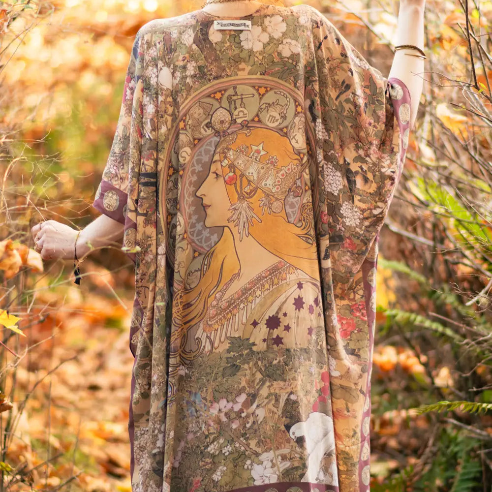 
                      
                        Back view of the Dreamweaver Zodiac Kimono by Market Of Stars featuring a woman and zodiac designs
                      
                    