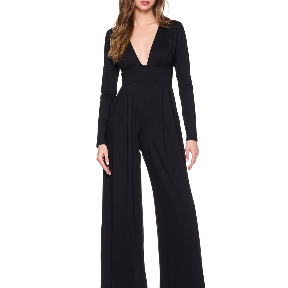 A woman wearing the Susana Monaco Very V Long Sleeve Jumpsuit