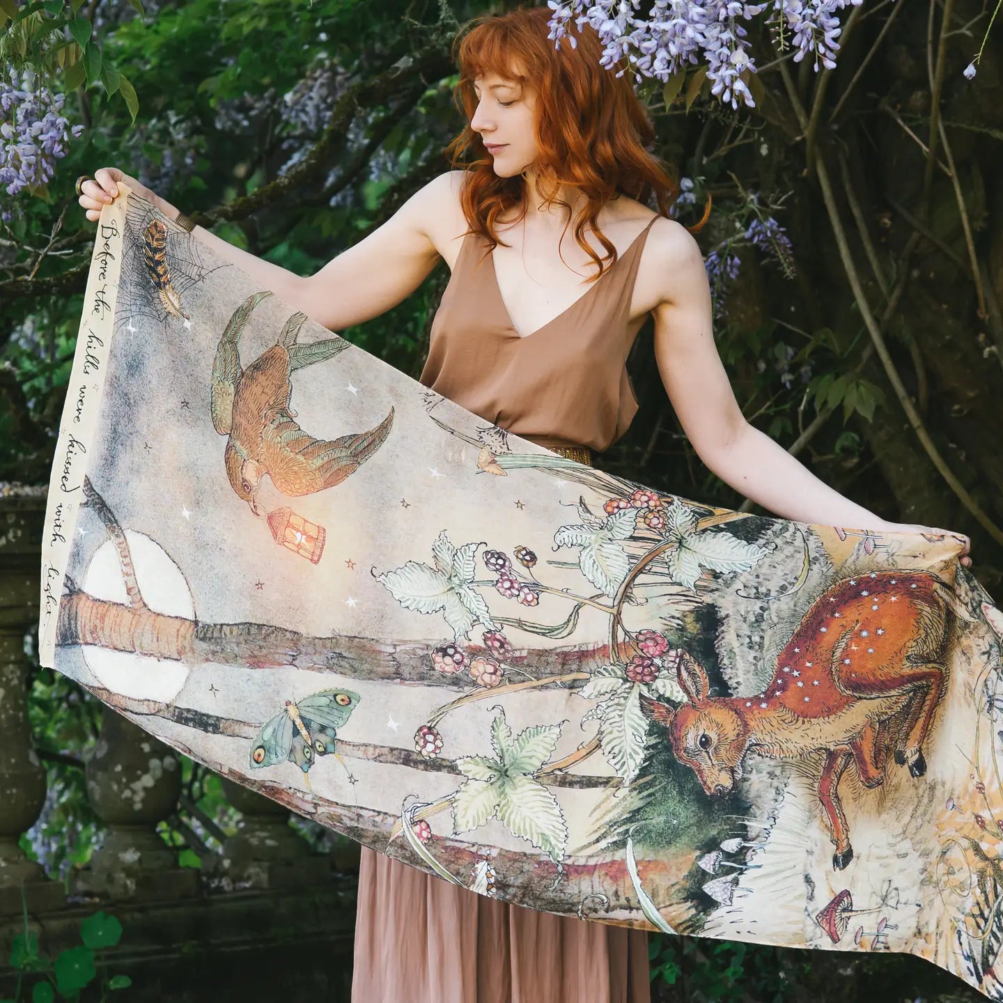 The Market Of Stars Lovelight Scarf features a woodland deer, swallow, and poetry detail design