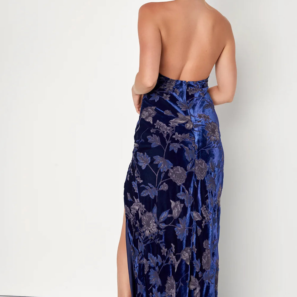 
                      
                        Back view of a woman wearing a Dark Blue Floral Burnout Velvet Halter Maxi Dress by Lulus
                      
                    