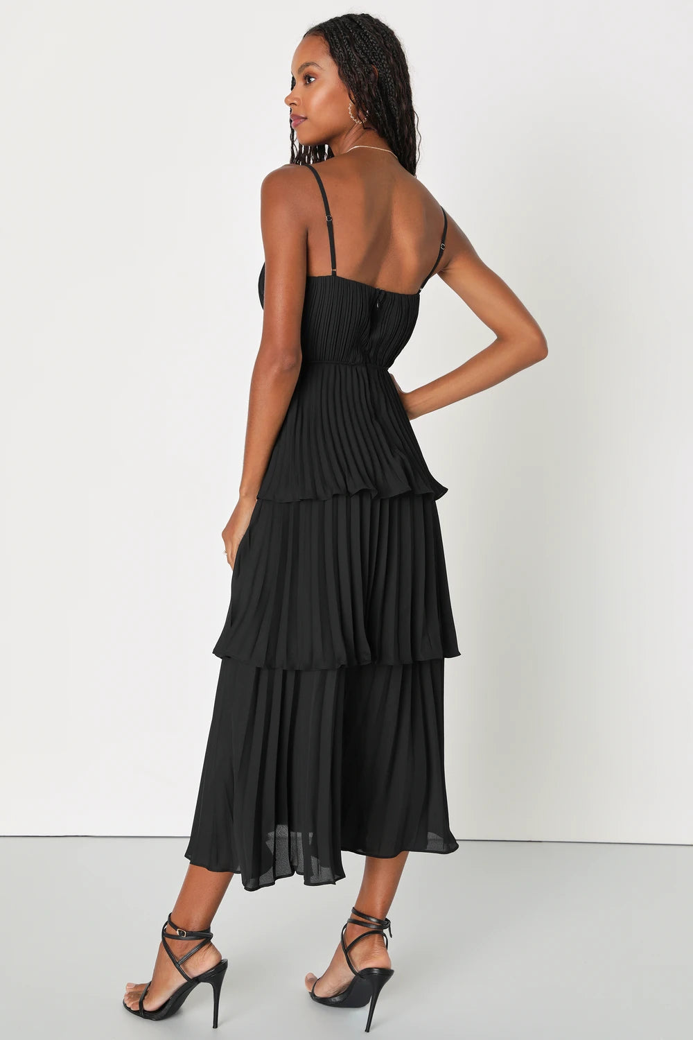 Back view of a woman wearing the Cascading Crush Black Tiered Bustier Midi Dress by Lulus