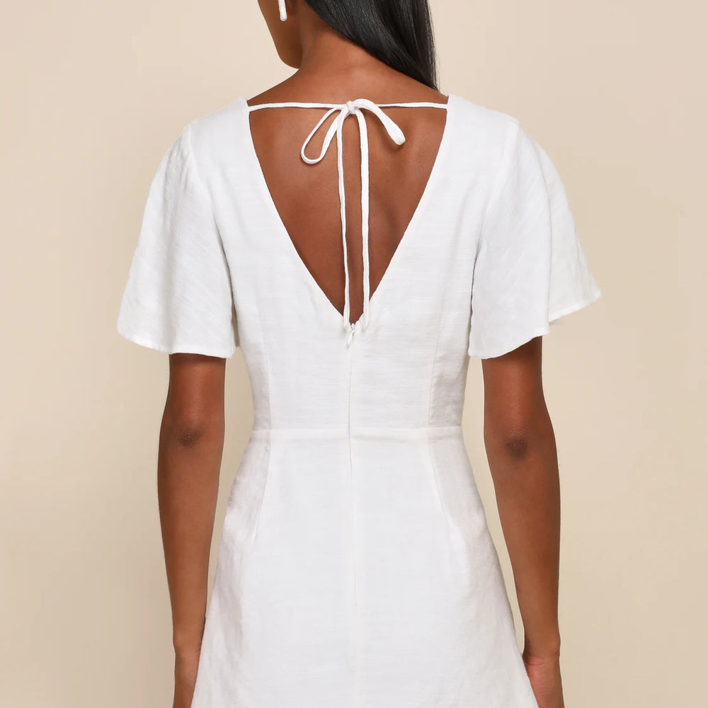 Back view of the Lulus Adorable Sensibility White Cutout Tie-Front Ruffled Mini Dress