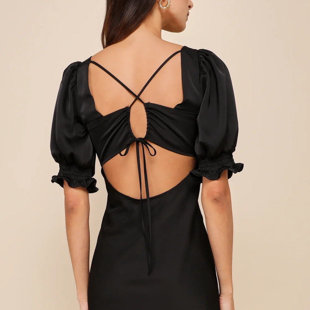 Back view of the Lulus Impressive Element Black Satin Lace-Up Puff Sleeve Mini Dress