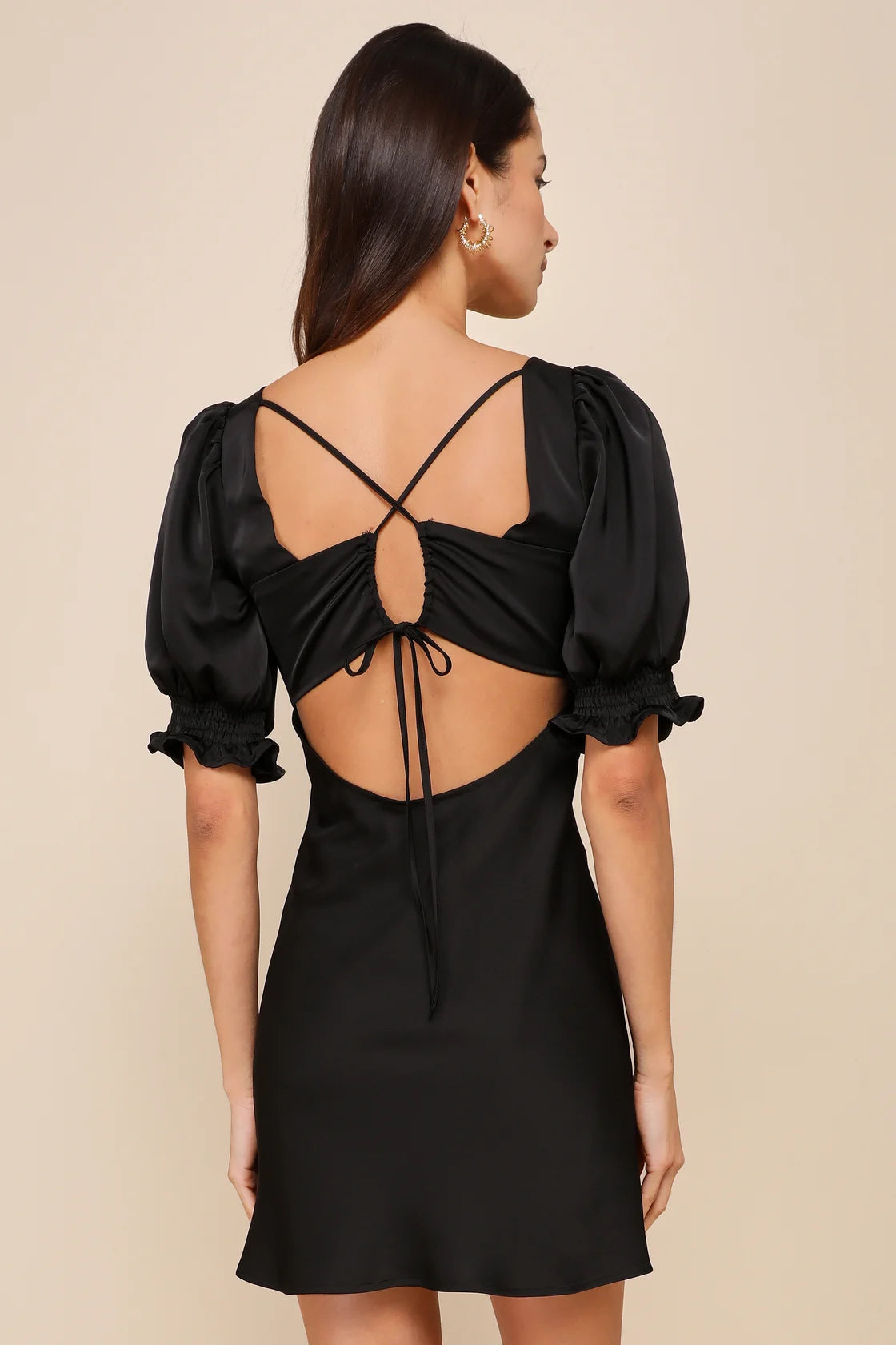 Back view of the Lulus Impressive Element Black Satin Lace-Up Puff Sleeve Mini Dress