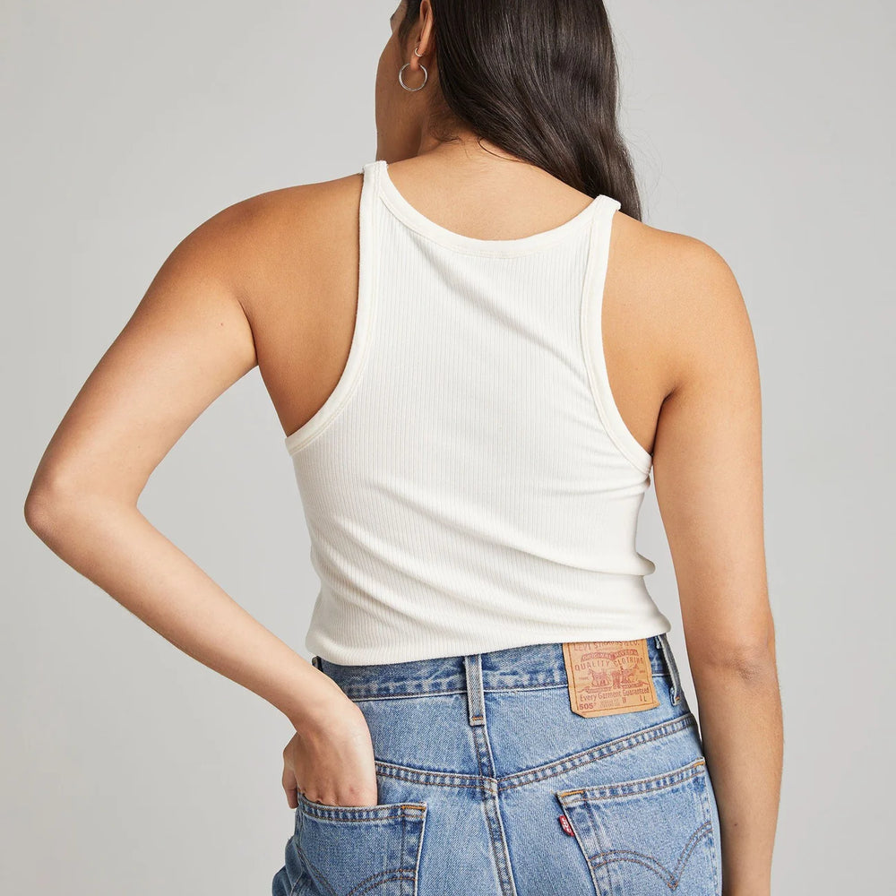 back view of model wearing white ribbed tank