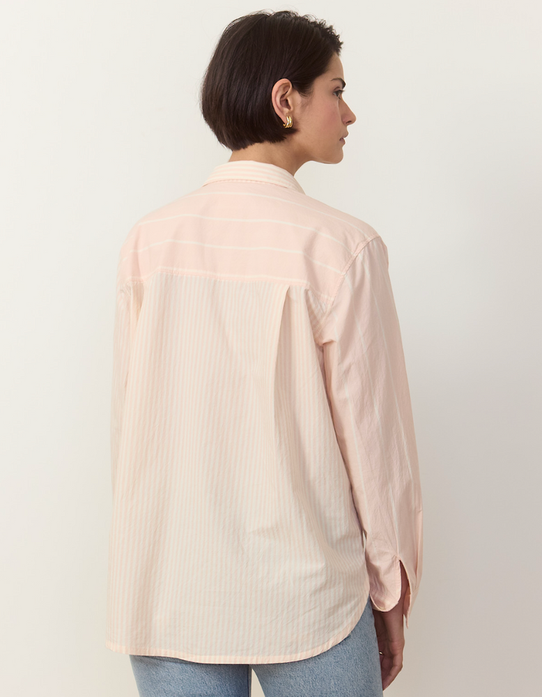 
                      
                        Women's blush pink striped button down shirt with a relaxed fit. 
                      
                    