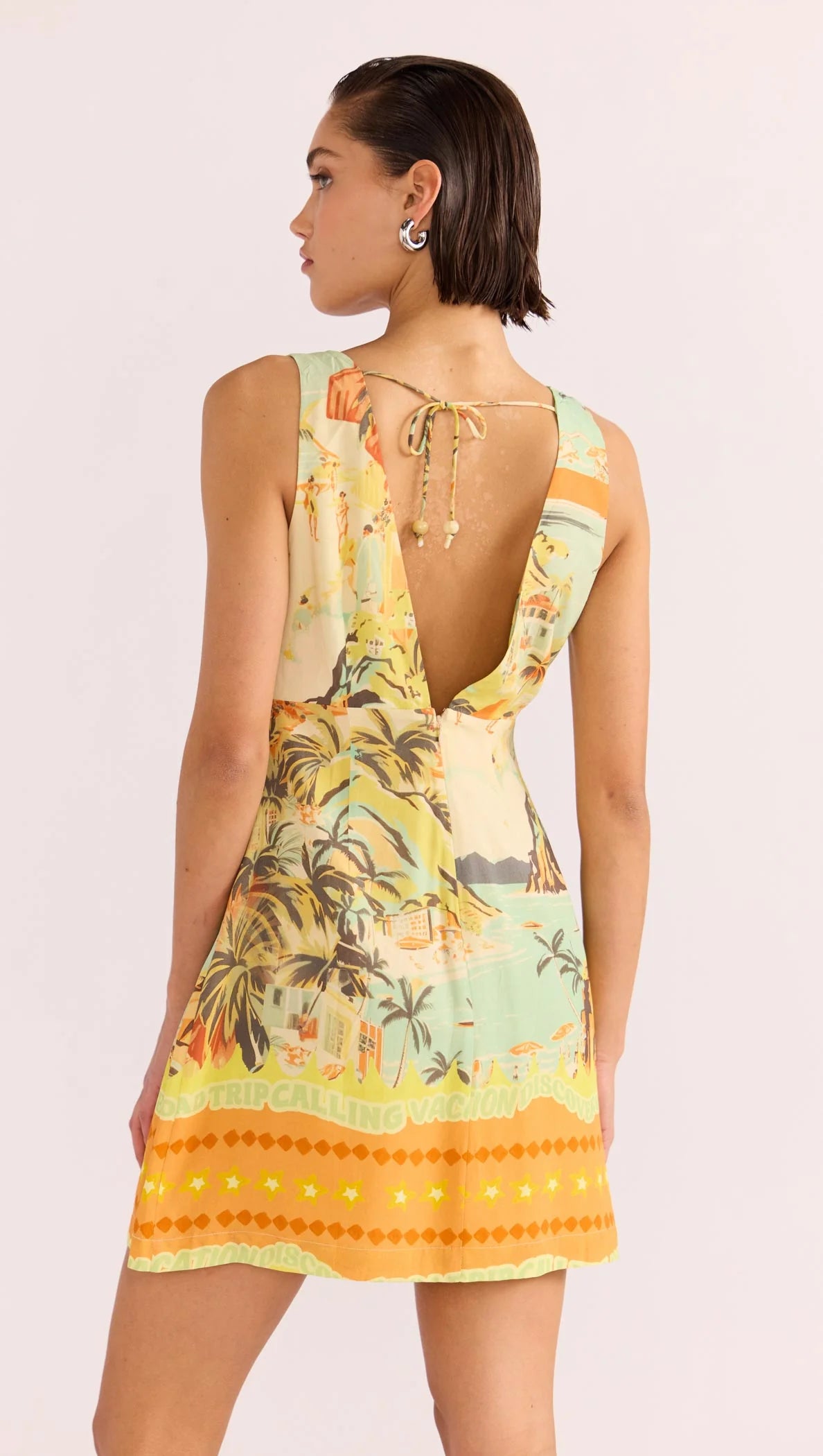 Women's beach print sleeveless mini dress with v-back