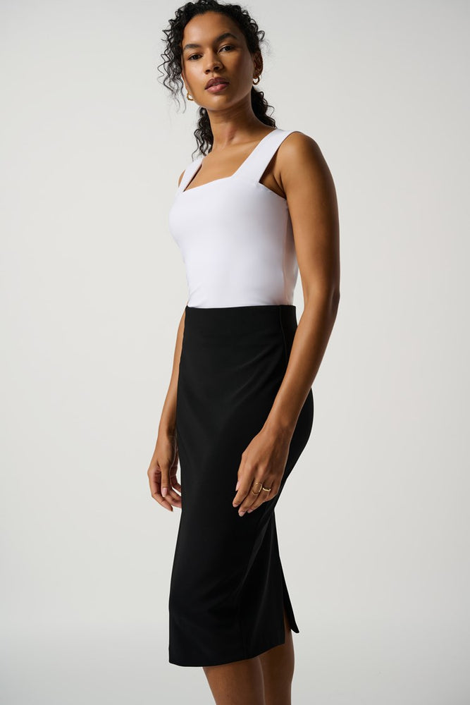 
                      
                        Woman wearing a high waisted black pencil skirt by Joseph Ribkoff
                      
                    