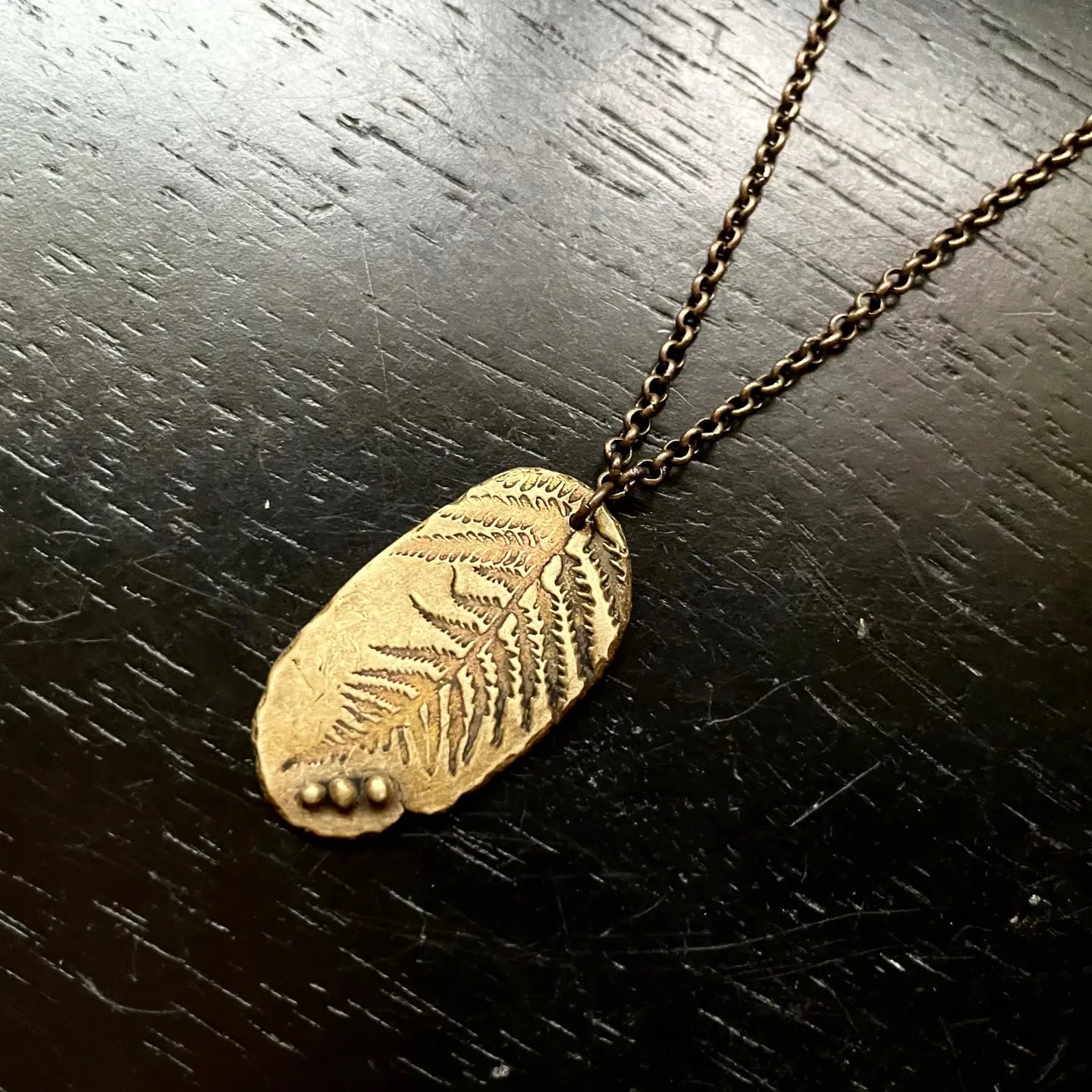 Shop the Brass Fern Fossil Leaf Medallion by local Vermont maker Jennifer Kahn Jewelry at Harbour Thread women's boutique. 