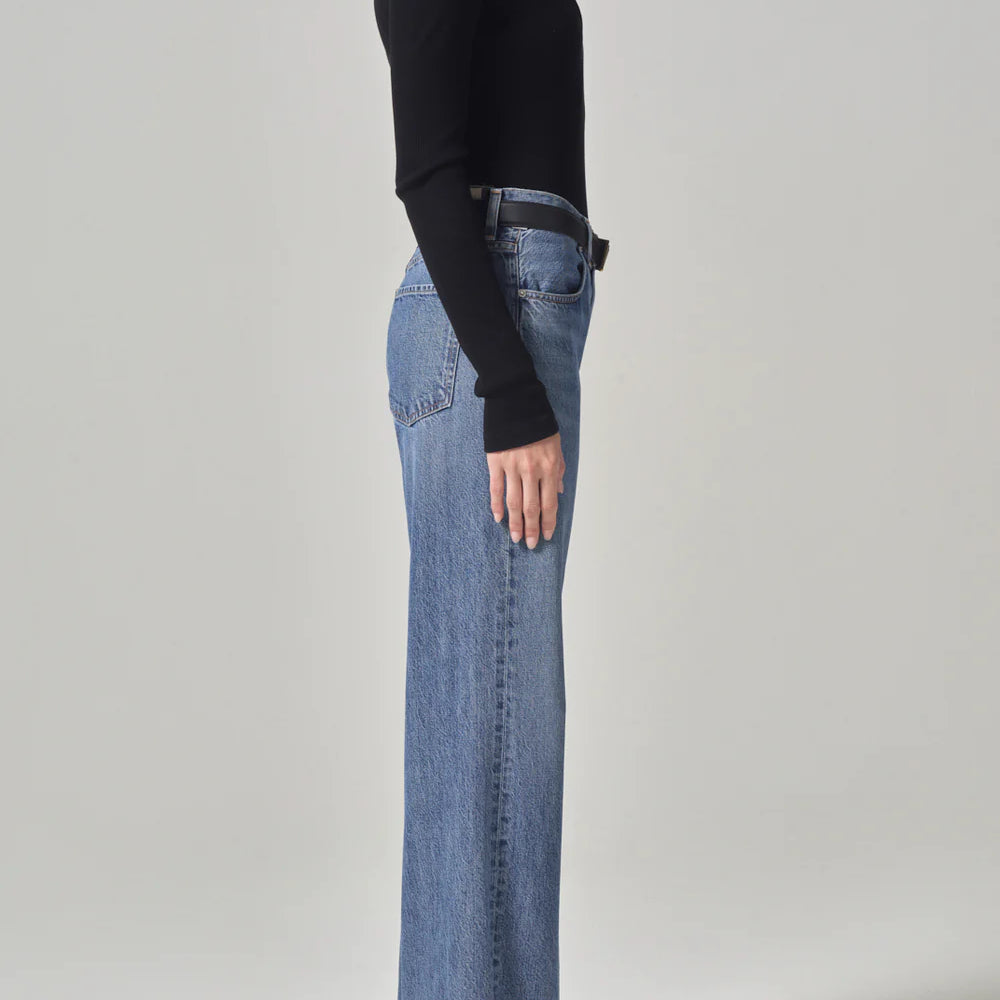 
                      
                        Side view of model wearing the Annina High Rise Wide Leg Jean by Citizens of Humanity
                      
                    