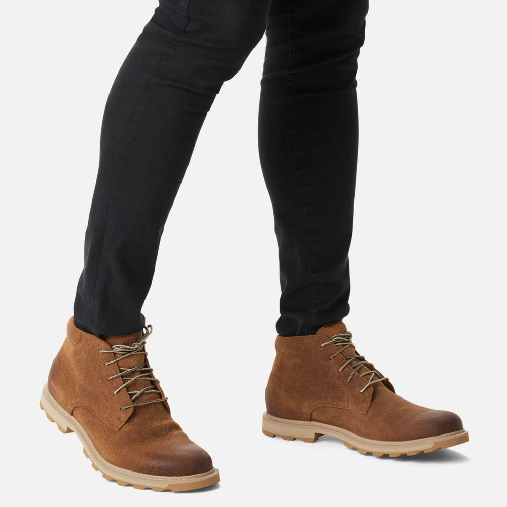 
                      
                        A person wearing the Tawny Buff Madson II Chukka Men's Waterproof Boot by Sorel
                      
                    