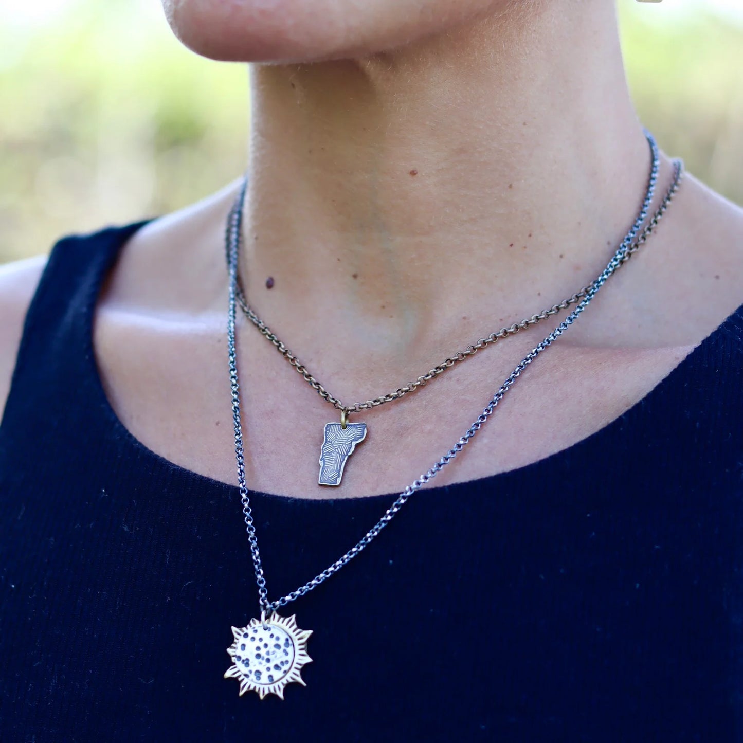 A woman wearing necklaces from Jennifer Kahn Jewelry