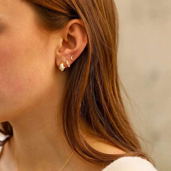Woman wearing the Saturn Hoops Earrings by Katie Waltman Jewelry