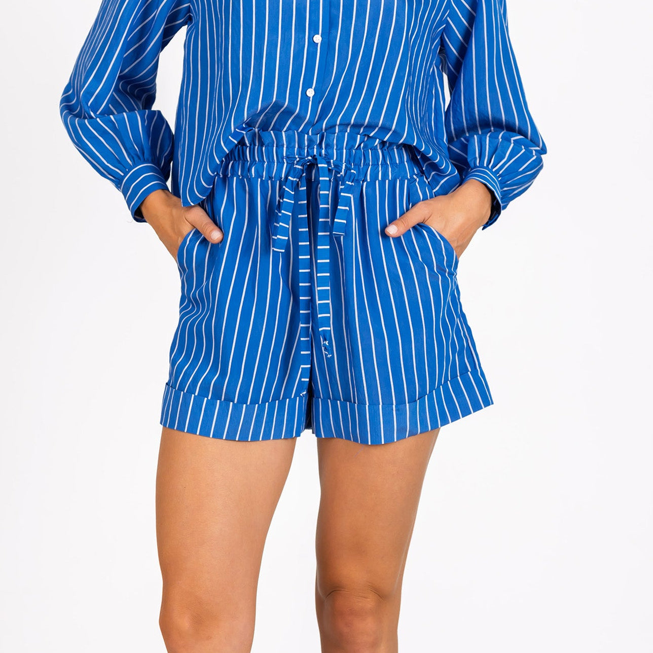 Woman wearing a blue and white striped shorts from Lavender Brown