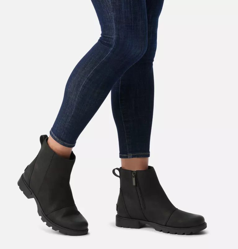 
                      
                        A woman wearing the Black Emelie III Women's Zip Waterproof Bootie by Sorel
                      
                    