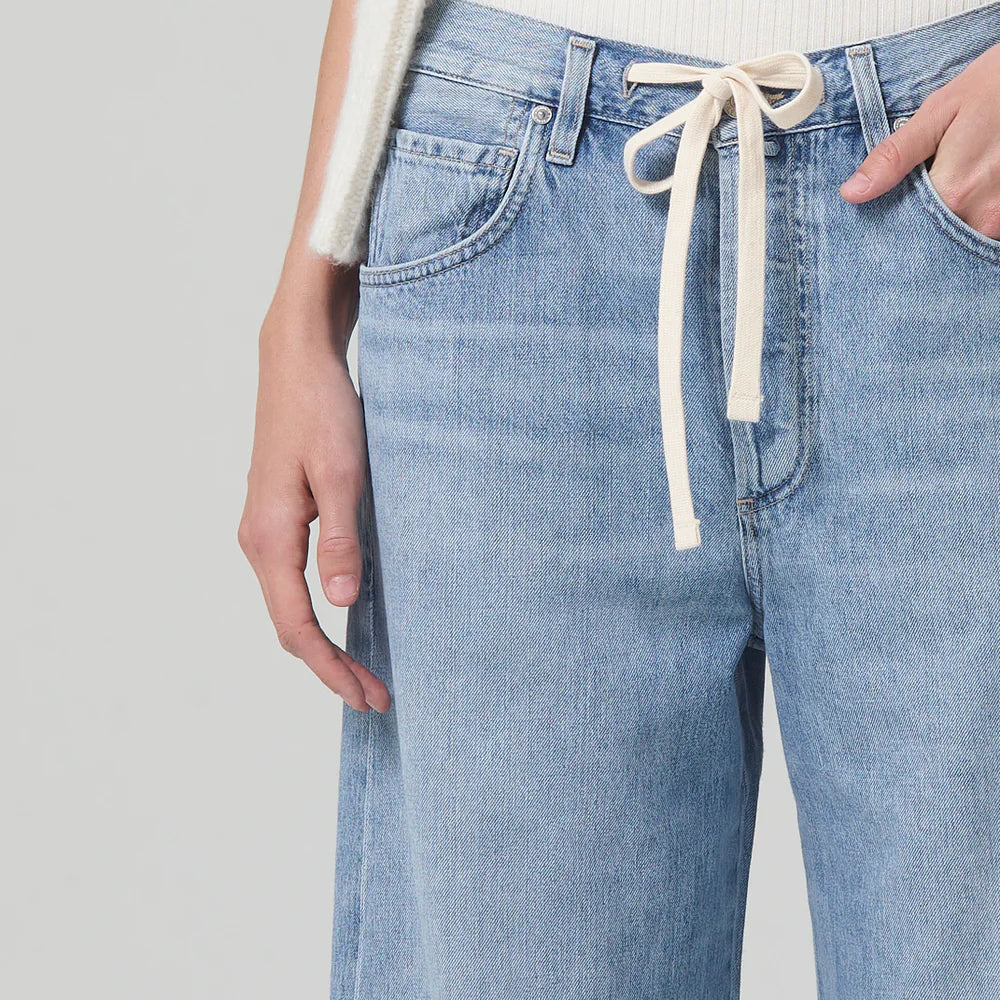 
                      
                        Close up view of the drawstring closure on the light indigo Brynn Drawstring Trouser by Citizens of Humanity
                      
                    