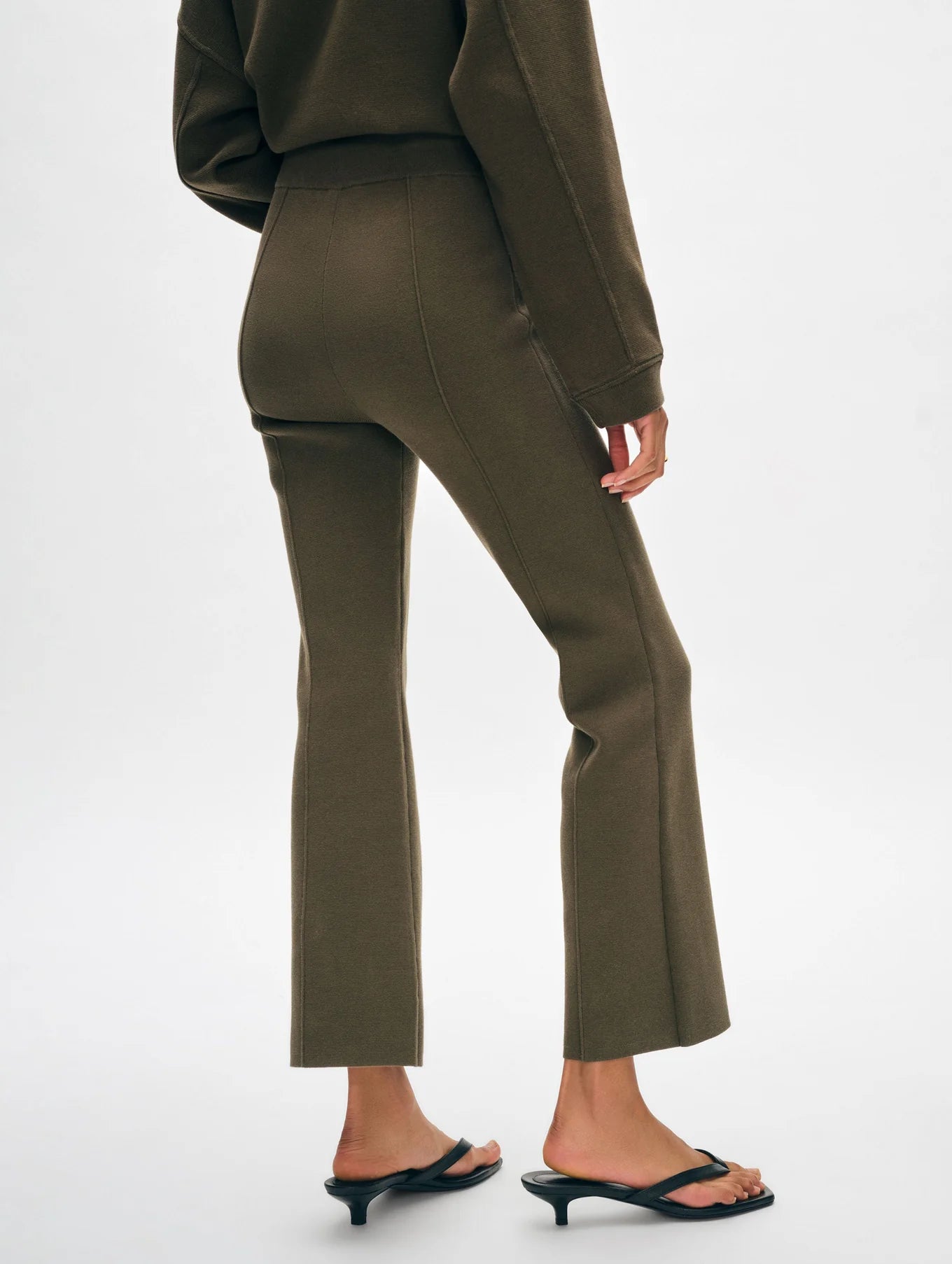 Back view of the Dark Sage Organic Cotton Kick Flare Pants by White + Warren