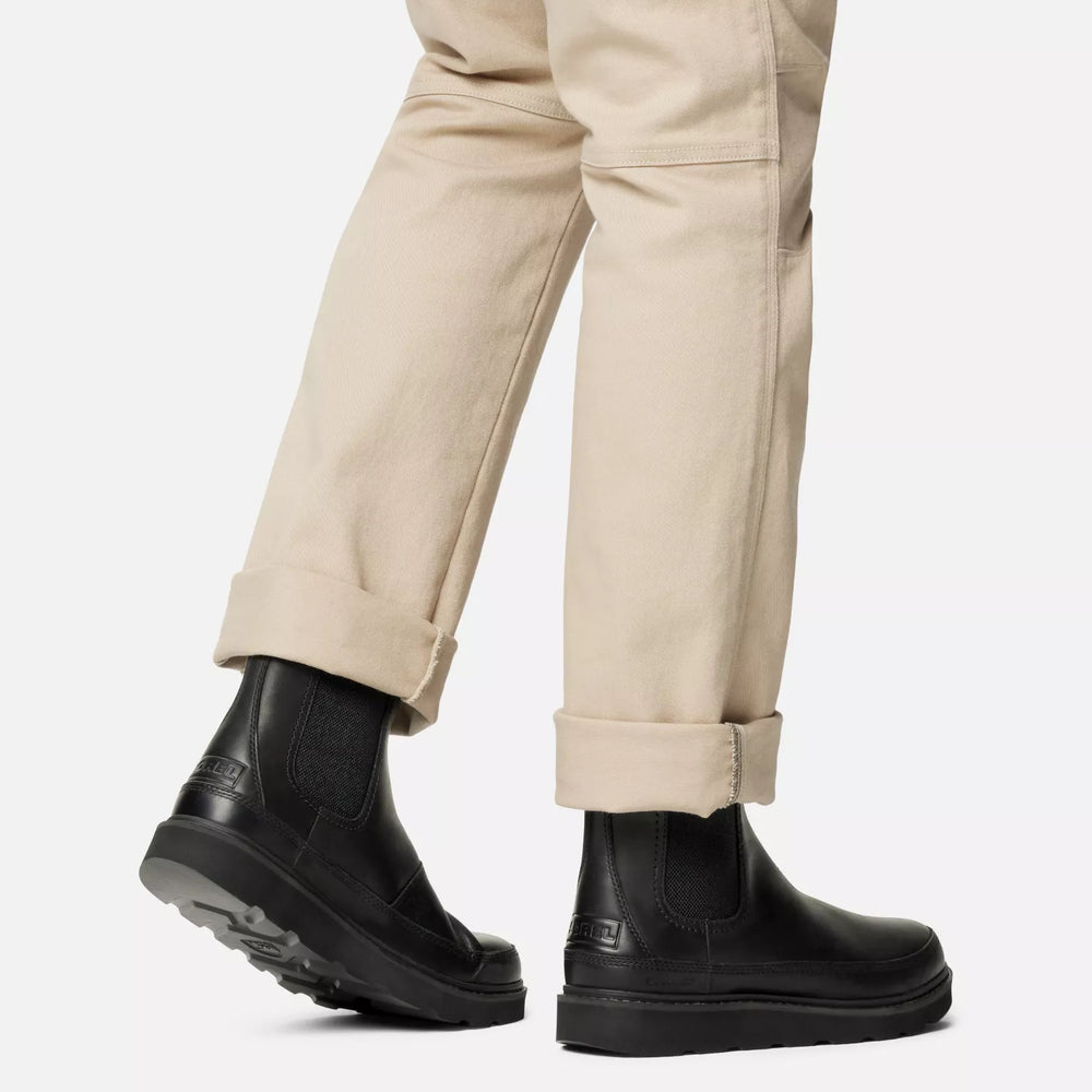 
                      
                        A person wearing the Black Slabtown 62 Men's Chelsea Waterproof Boot by Sorel
                      
                    