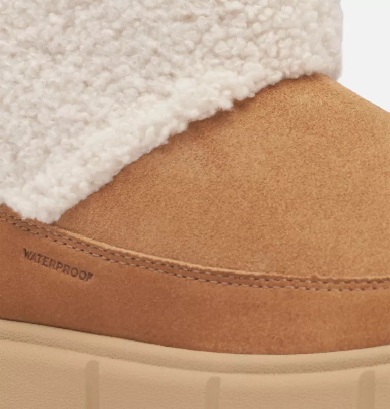 
                      
                        Design detail on the The Tawny Buff Explorer III Slip-On Cozy Waterproof Boot by Sorel.
                      
                    