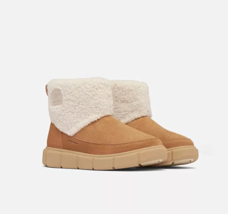 
                      
                        The Tawny Buff Explorer III Slip-On Cozy Waterproof Boot by Sorel.
                      
                    