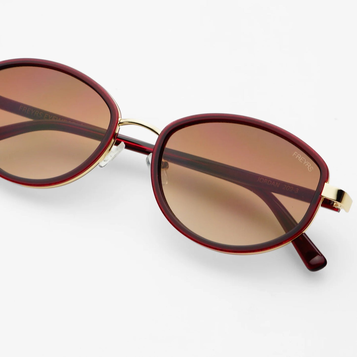 The FREYRS Jordan Women's Oval Sunglasses in the color Burgundy