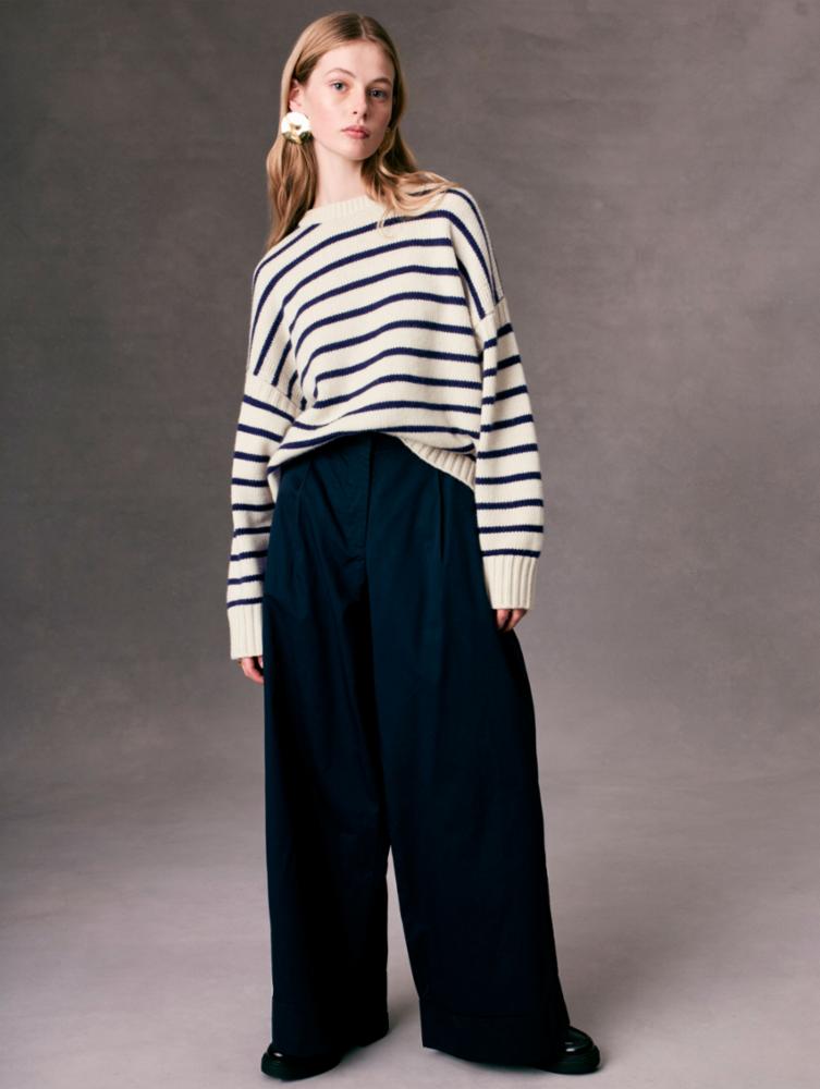 Front view of a woman wearing the Cashmere Blend Striped Crewneck by White + Warren paired with wide leg trousers