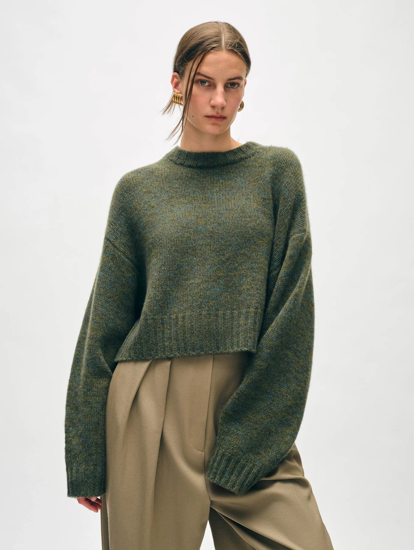 The Cashmere Luxe Crewneck in the color Green Marl by the brand White + Warren