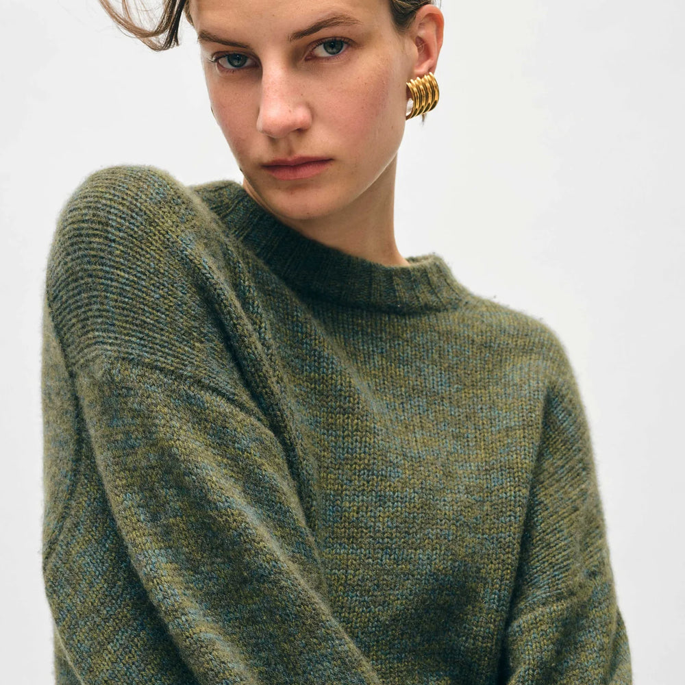 
                      
                        Front detail on the Cashmere Luxe Crewneck in the color Green Marl by the brand White + Warren
                      
                    