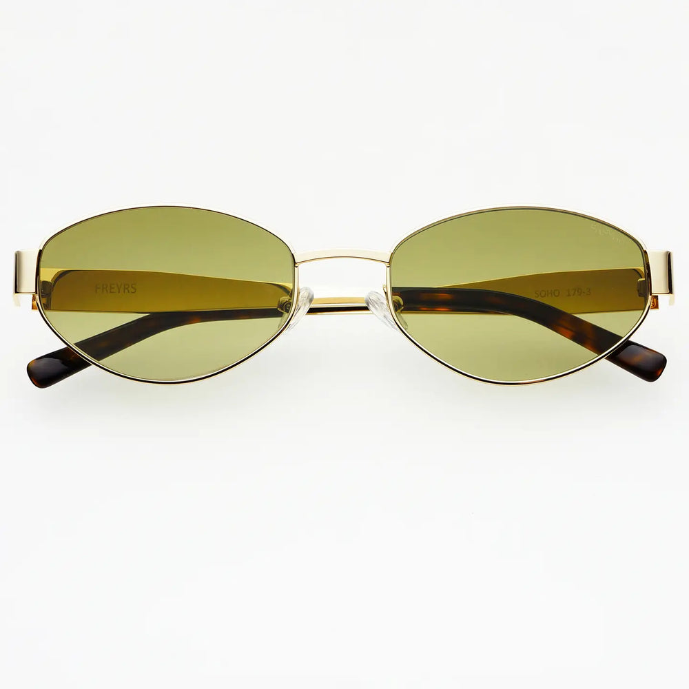 
                      
                        Gold-framed sunglasses with green lenses on a white background
                      
                    