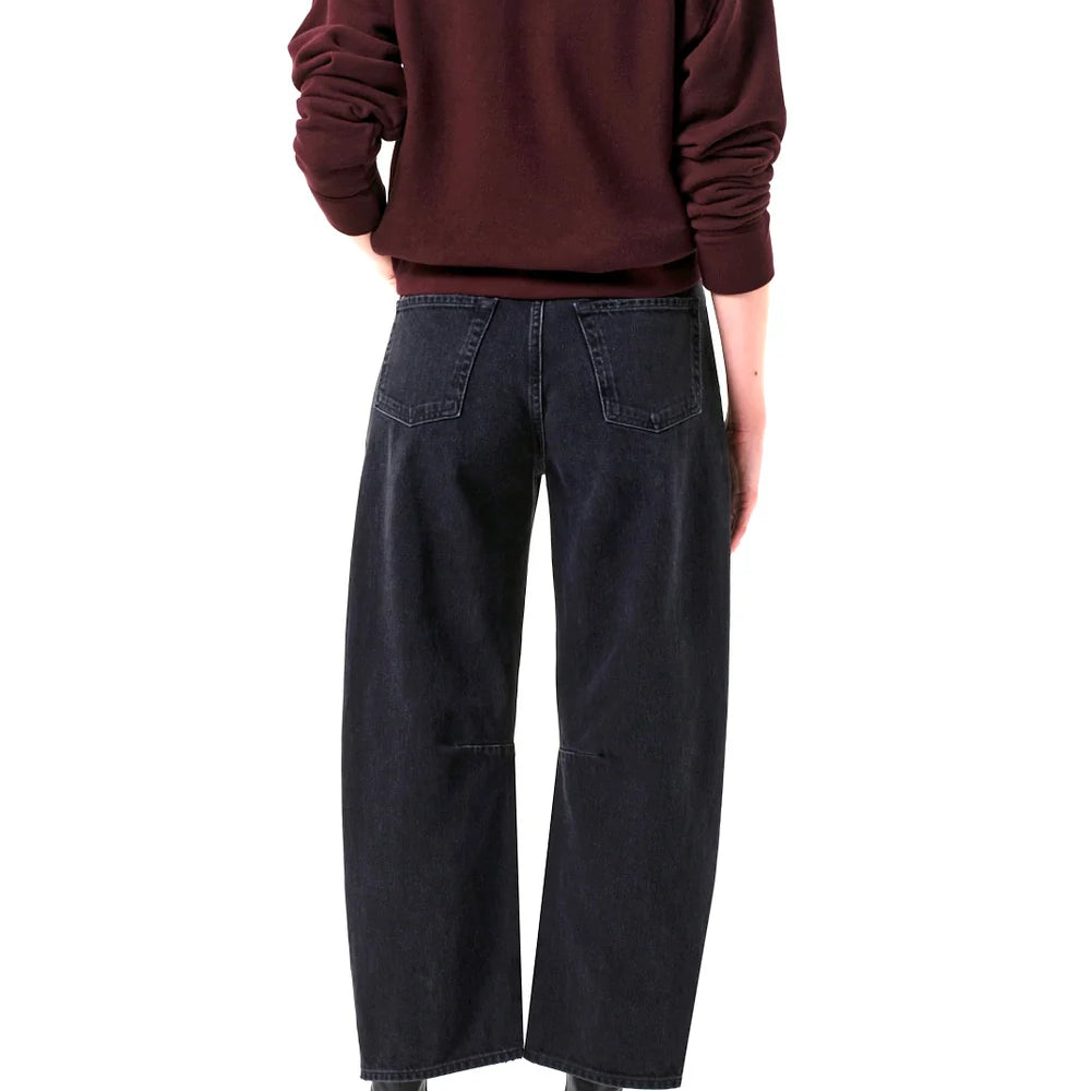 
                      
                        Person wearing a maroon sweater and black Citizens Of Humanity Miro Jeans
                      
                    