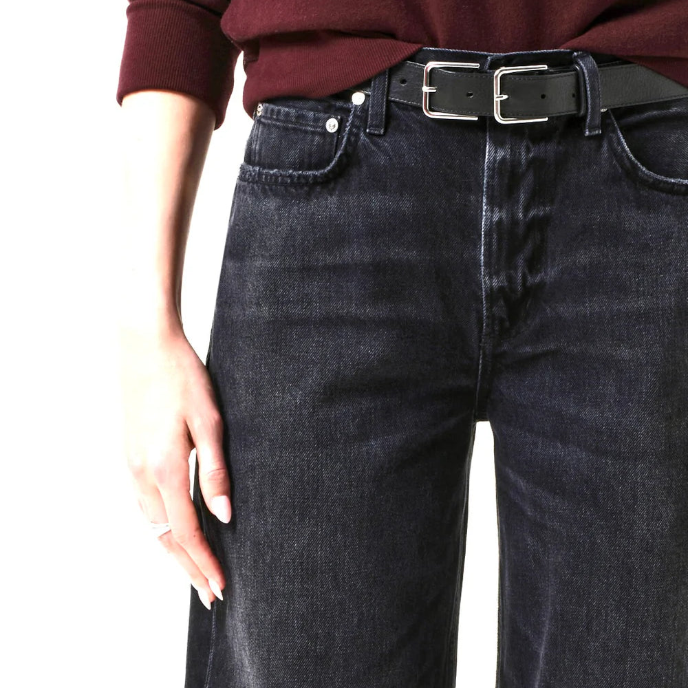 
                      
                        Person wearing dark jeans from Citizens Of Humanity and a burgundy top with a black belt.
                      
                    