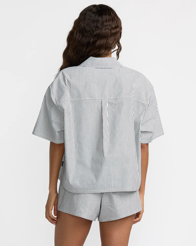 The RVCA Mikey short sleeve button down top offers a boxy fit