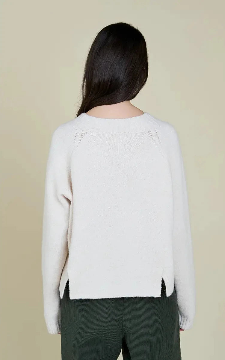 This women's sweater from Grade and Gather features back vent details