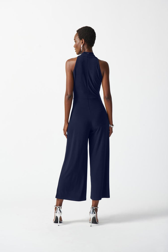 
                      
                        Back view of Joseph Ribkoff's Silky Knit Wrap Culotte Jumpsuit in the color Midnight Blue
                      
                    