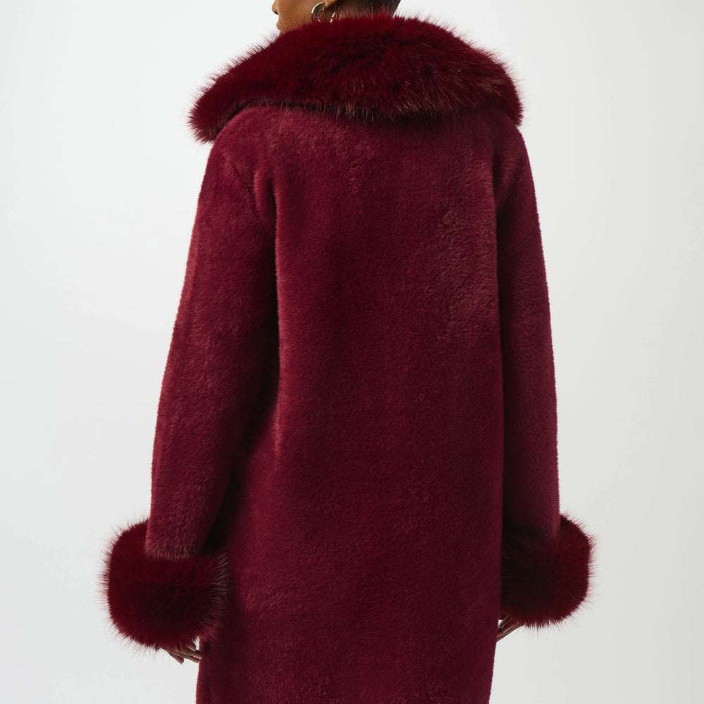 
                      
                        Woman wearing a red coat with fur trim from Joseph Ribkoff
                      
                    