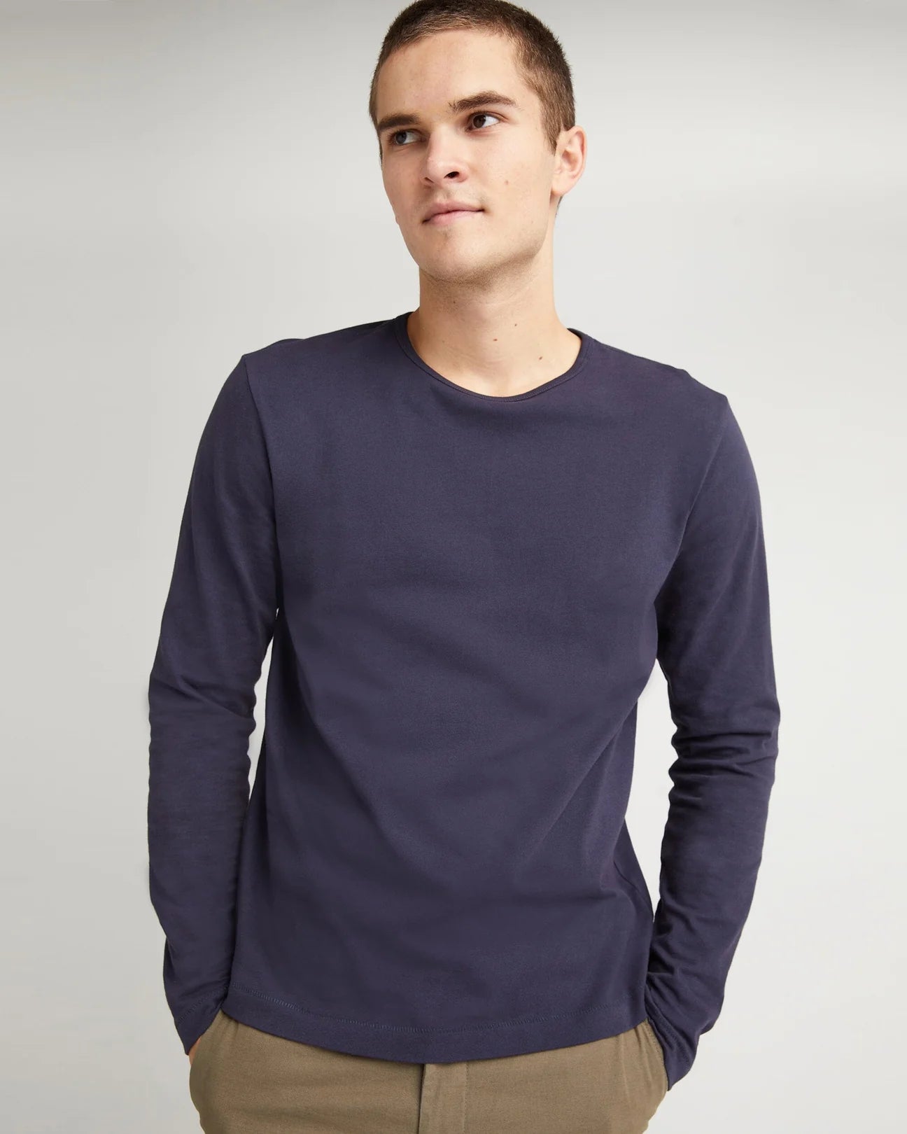 front view of model wearing a long sleeve blue color  t-shirt
