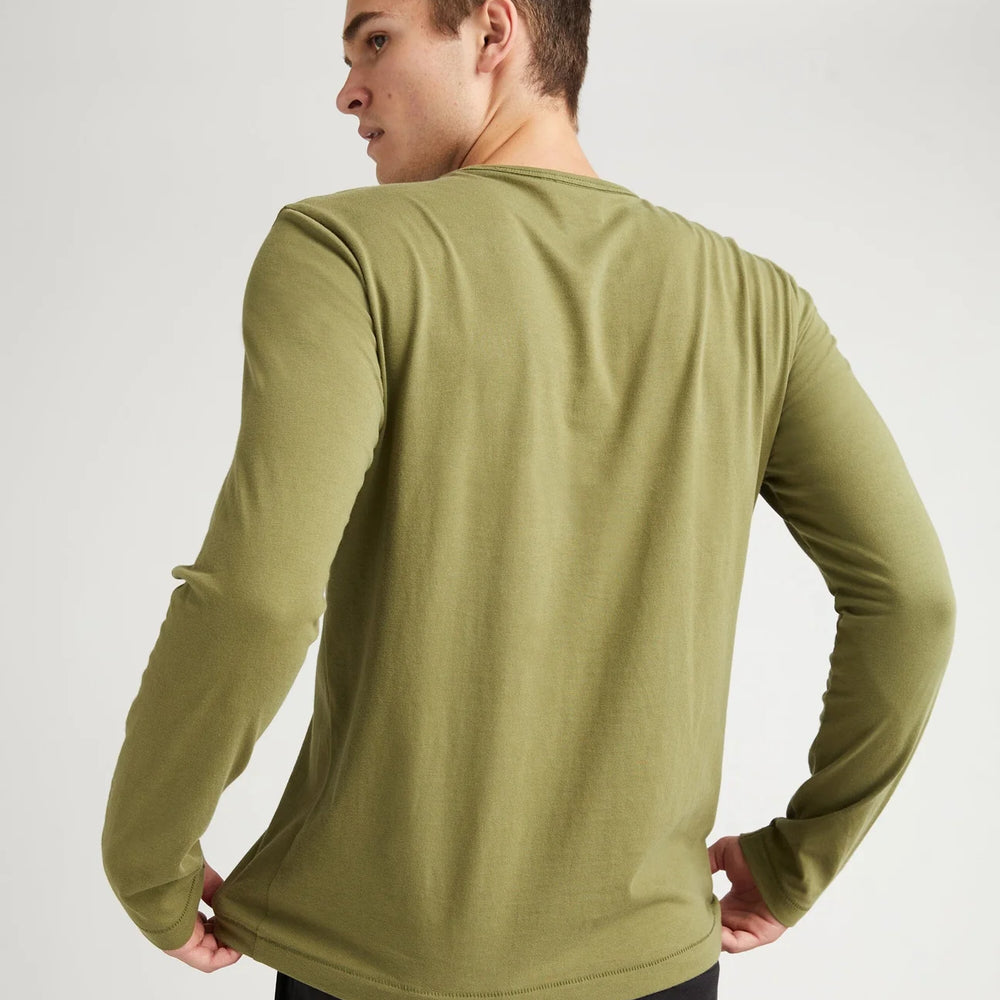 
                      
                        Back view of a man wearing the Weighted Organic Cotton Long Sleeve Tee by Richer Poorer in the color Olive Army
                      
                    