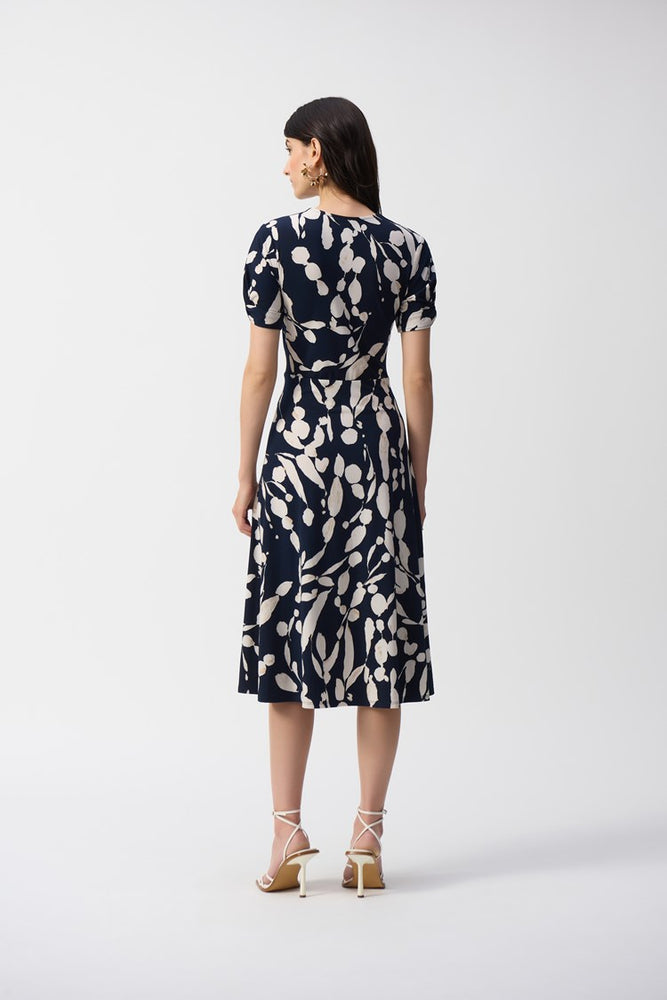 
                      
                        The Silky Knit Abstract Print Wrap Dress from Joseph Ribkoff offers a slightly flowy fit and flare silhouette
                      
                    