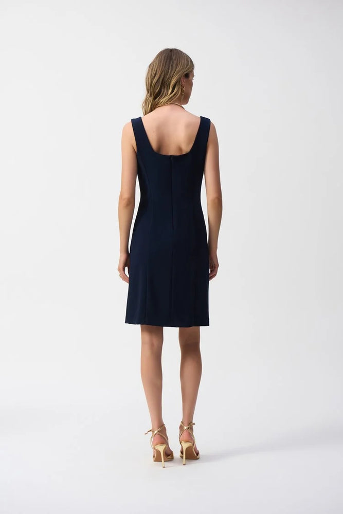 
                      
                        Joseph Ribkoff's Silky Knit Sleeveless Sheath Dress offers a slightly scooped back with back zip closure

                      
                    