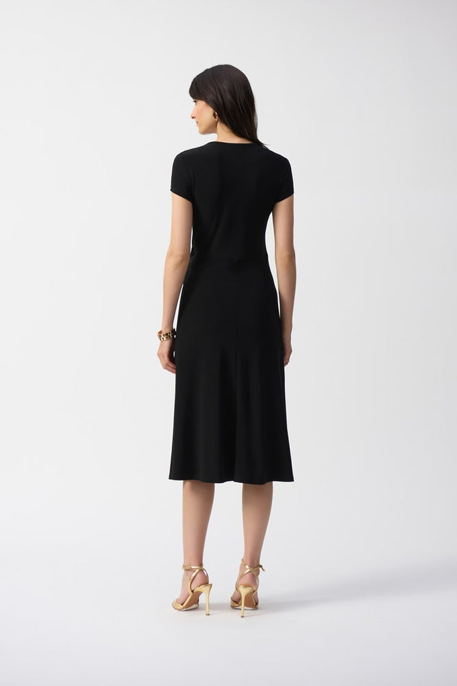 
                      
                        The Silky Knit Flowy Wrap Dress by Joseph Ribkoff falls below the knee in a flared midi silhouette
                      
                    