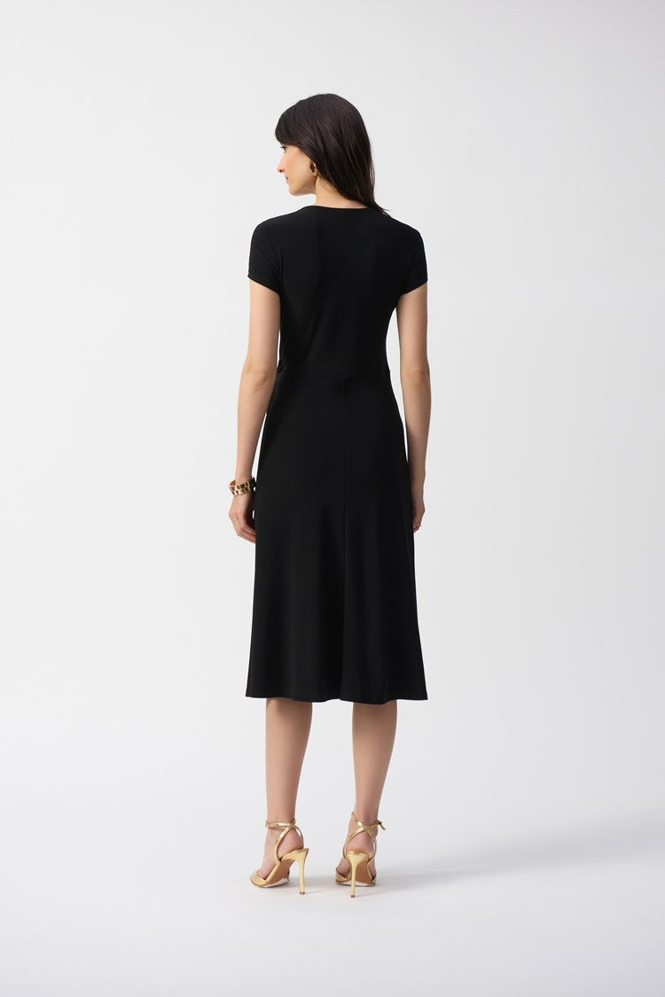 The Silky Knit Flowy Wrap Dress by Joseph Ribkoff falls below the knee in a flared midi silhouette