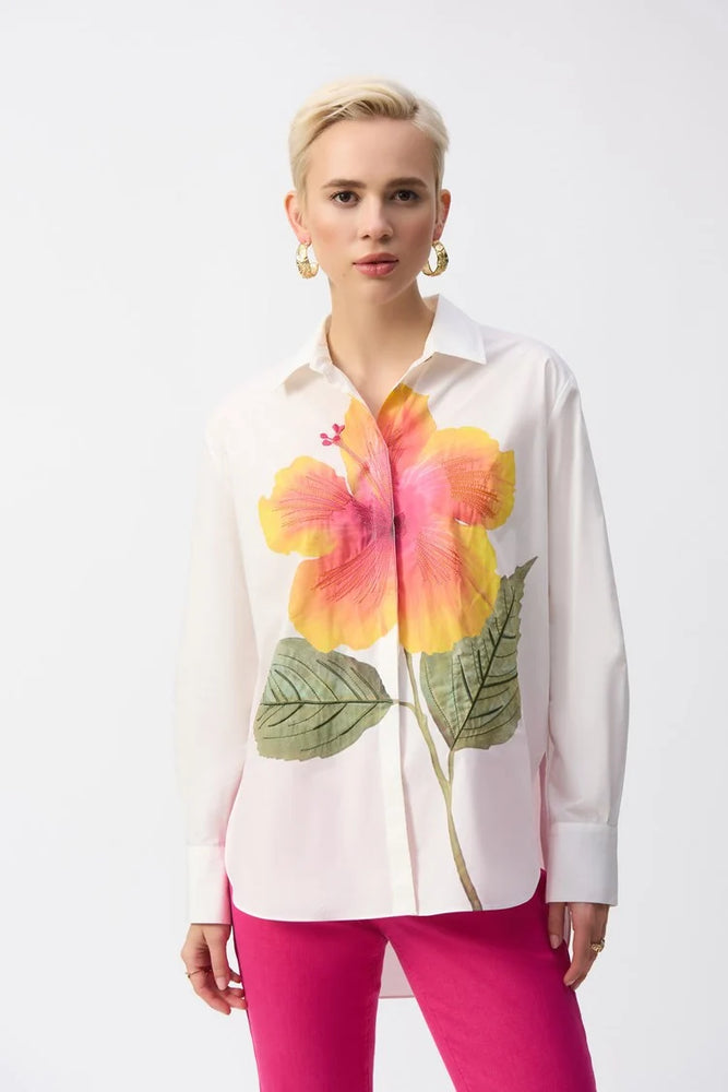 
                      
                        Women's white button down shirt with a boxy fit and large flower embroidered on the front. 
                      
                    