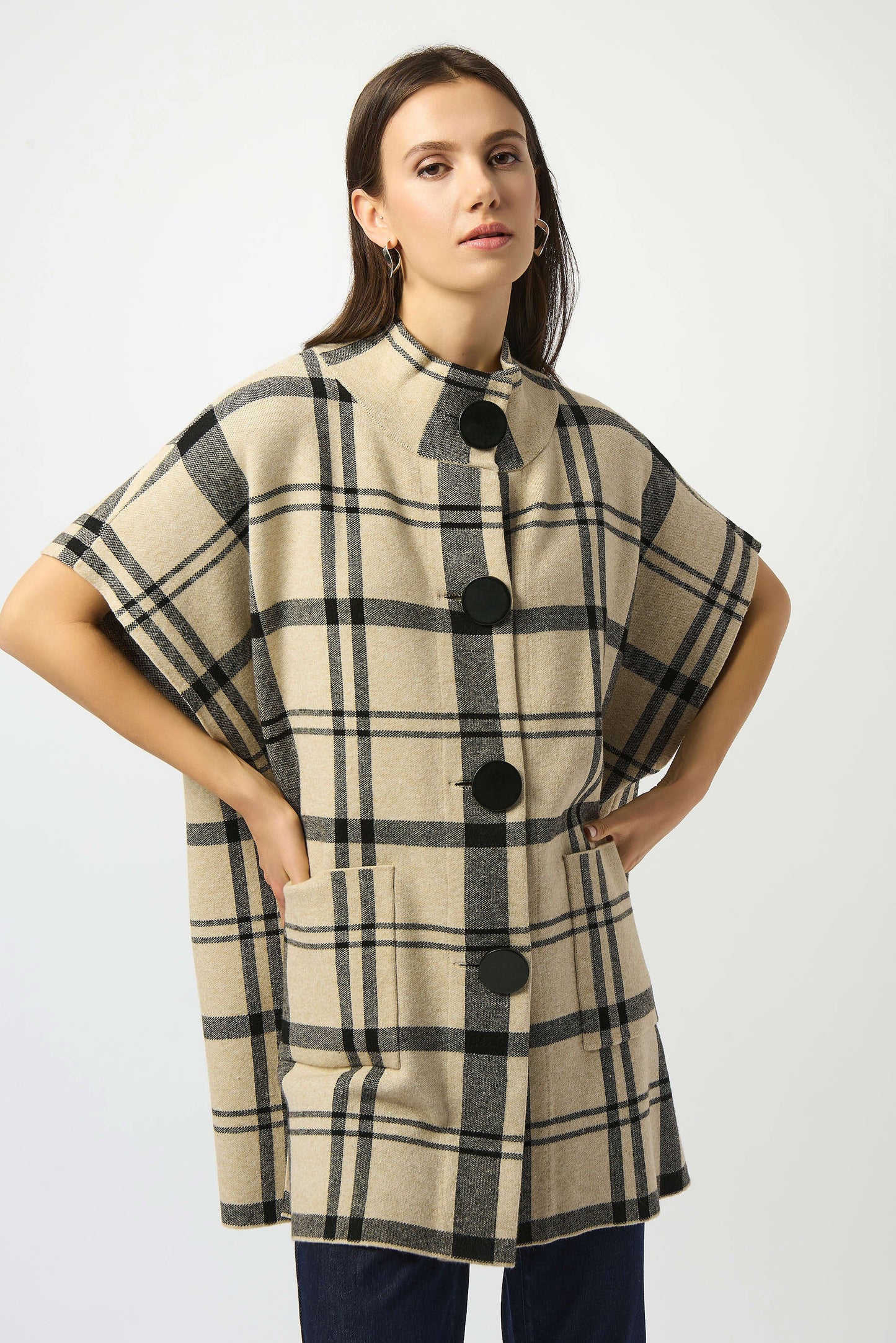 Crafted from a soft and cozy sweater knit, this plaid poncho from Joseph Ribkoff will elevate any cold-weather look. Now at Harbour Thread in Burlington, VT.