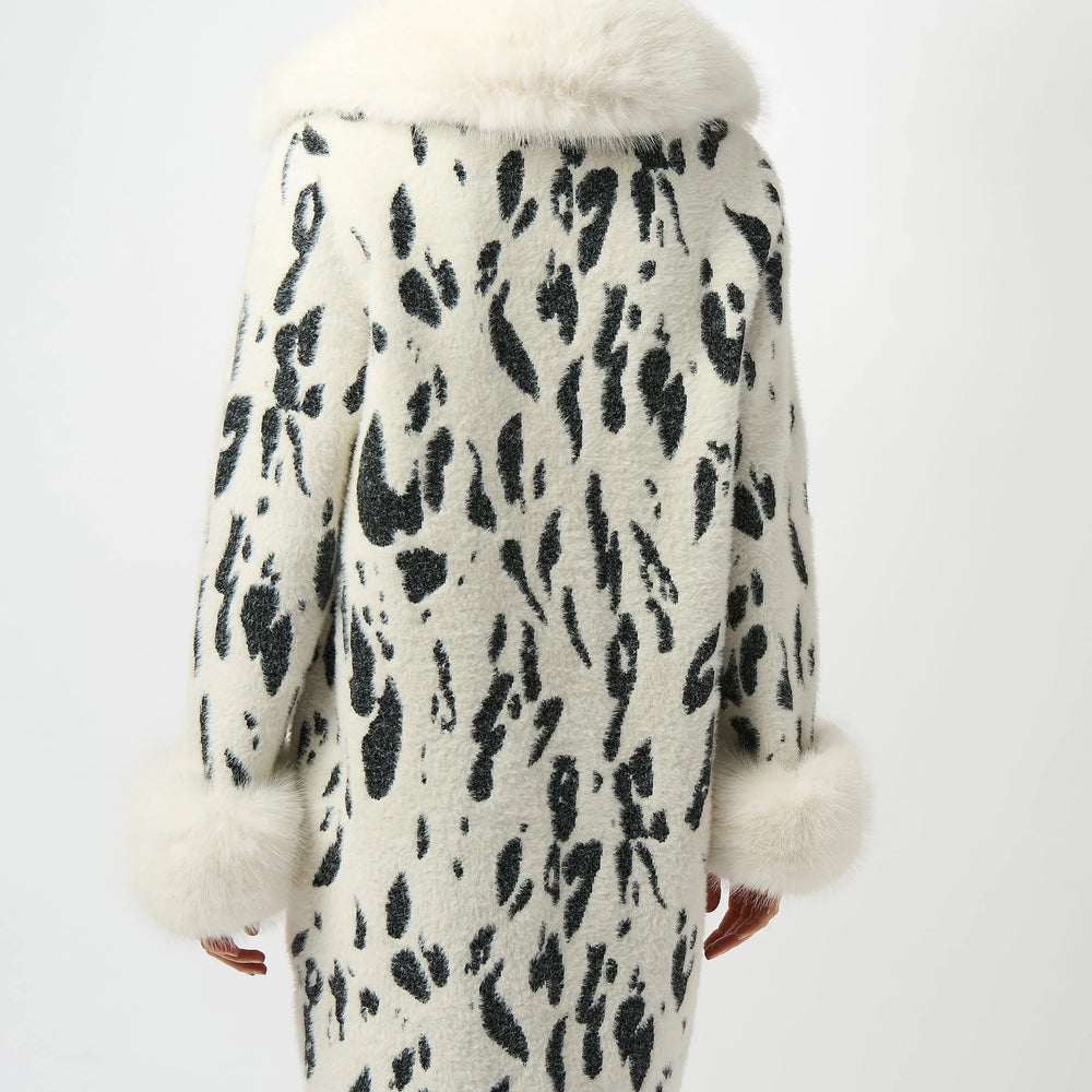 
                      
                        Woman wearing an animal print faux fur coat
                      
                    