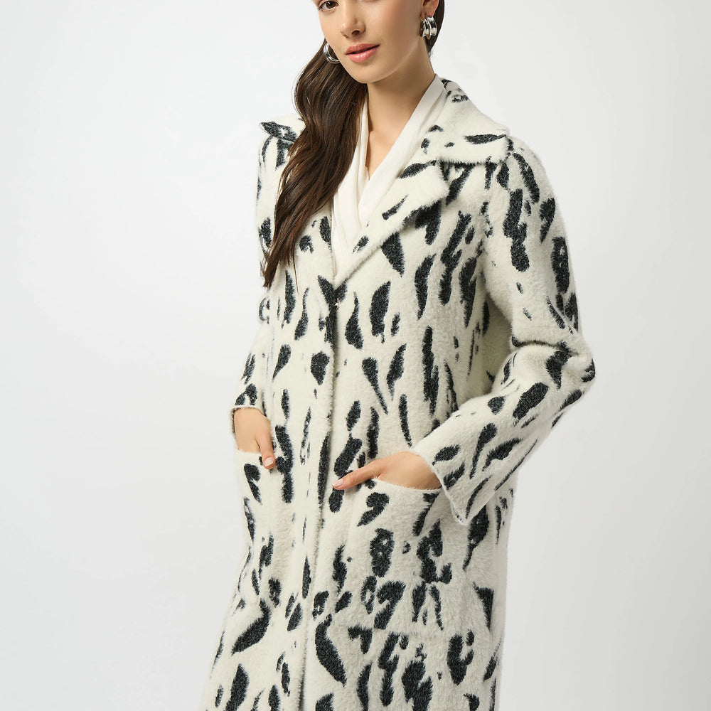 
                      
                        Woman wearing a black and white jacket with pockets
                      
                    