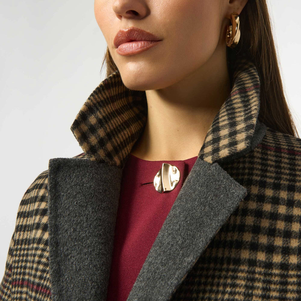 Close up of a woman wearing the Wool Blend Plaid Double-Faced Coat from Joseph Ribkoff to feature the notched collar