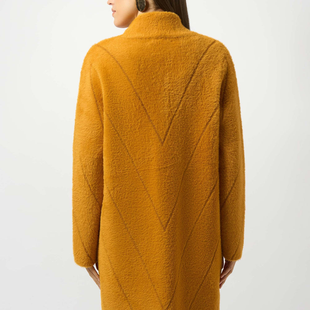 
                      
                        Woman wearing a mustard yellow coat 
                      
                    